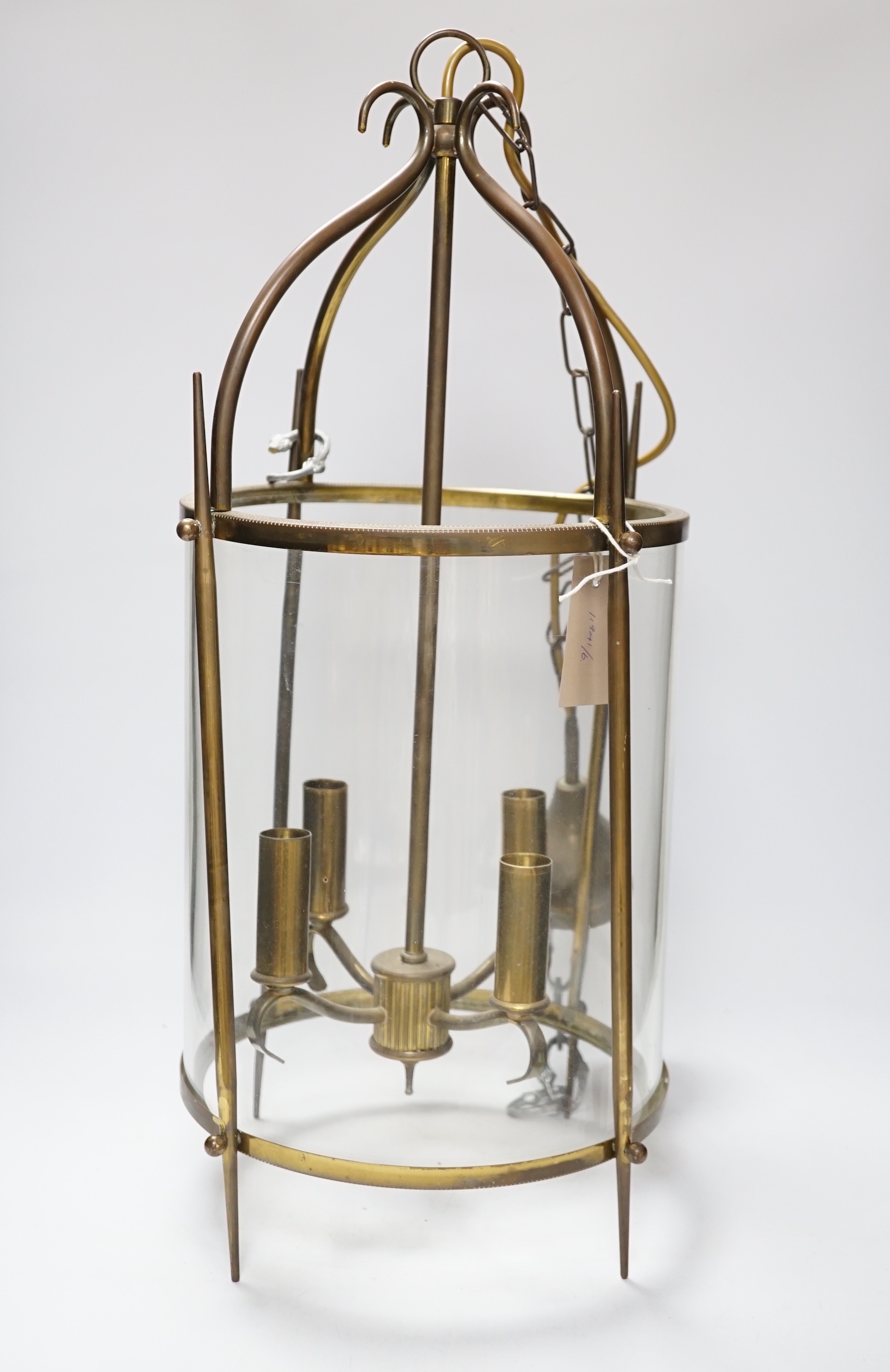 A circular brass and glass four light lantern 59cm high